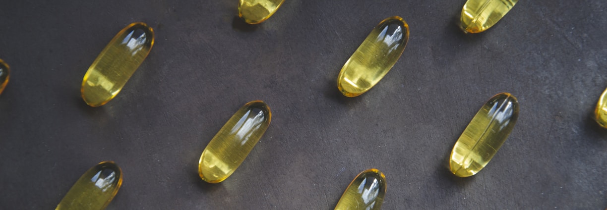 a bunch of yellow pills sitting on top of a table